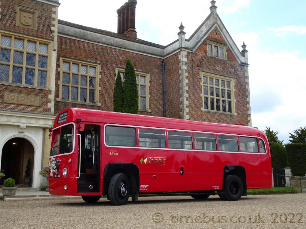 Cute single deck classic London bus ready for guests - North Mymms Park
