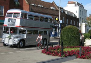[Silver Routemaster, Cyclist, Pedestrian and Flowerbed in St Albans]